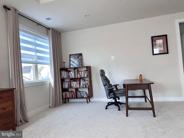 a room with furniture and wooden floor