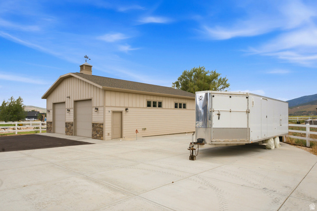 560 Aspen Road Francis, UT 84036 - Photo 59 of 59 Detached garage featuring dual bay doors and stone facade accents