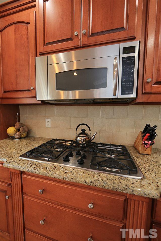 8215 Ortin Lane Raleigh, NC 27612 - Photo 12 of 29 Top of the line Gas Cooktop!