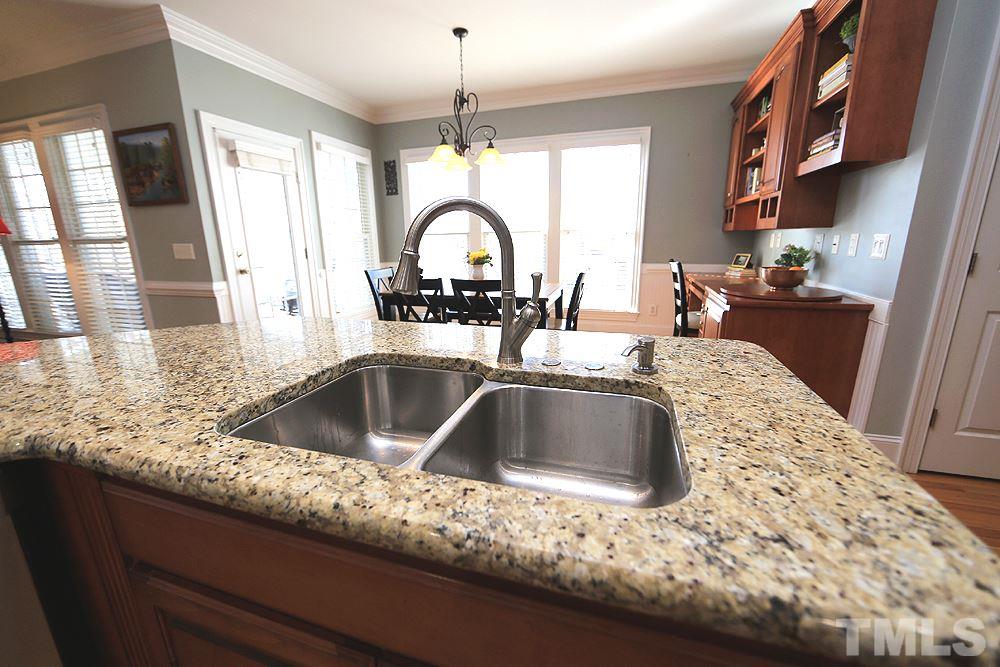8215 Ortin Lane Raleigh, NC 27612 - Photo 13 of 29 Looking into eating area from behind island!