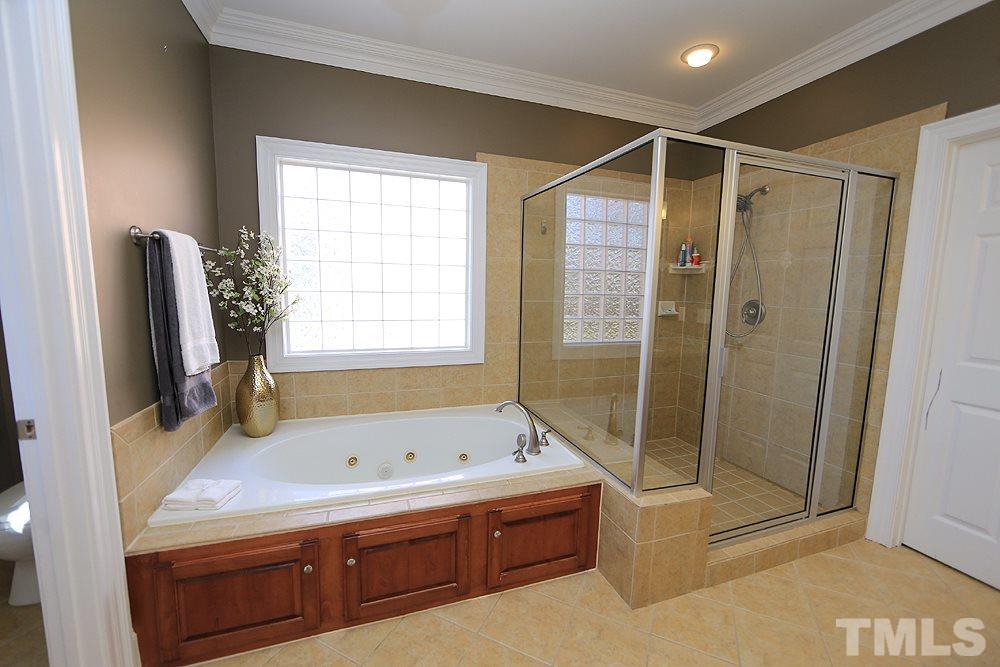 8215 Ortin Lane Raleigh, NC 27612 - Photo 17 of 29 Large jetted tub! Oversized tile Shower!