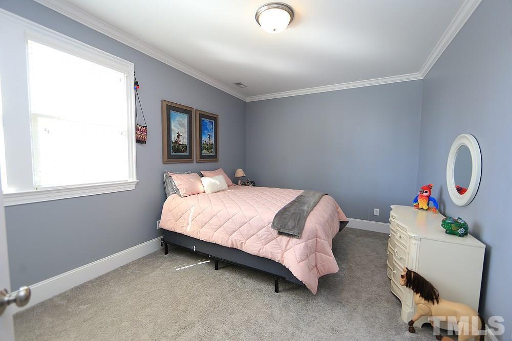 8215 Ortin Lane Raleigh, NC 27612 - Photo 19 of 29 Very nice sized second Bedroom with walk-in closet!
