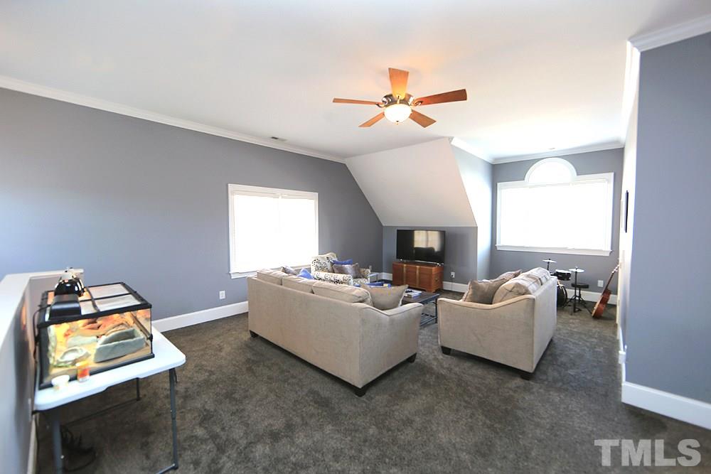 8215 Ortin Lane Raleigh, NC 27612 - Photo 24 of 29 Beautiful Bonus with extra, extra large walk-in that leads to huge floored unfinished space!