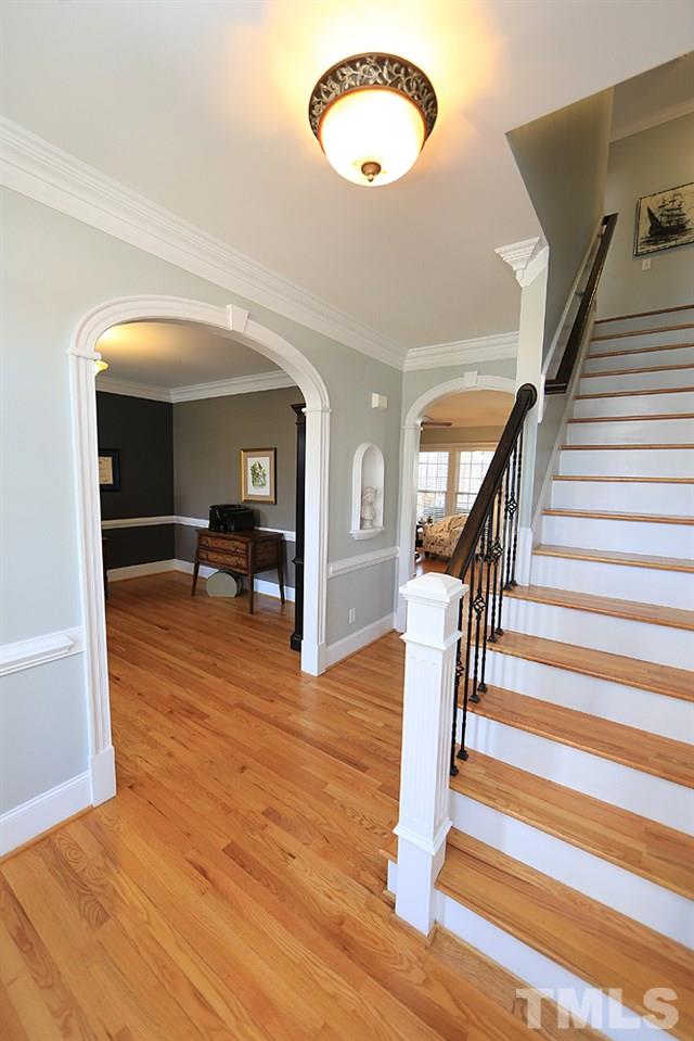 8215 Ortin Lane Raleigh, NC 27612 - Photo 4 of 29 Beautiful hardwood stairs!
