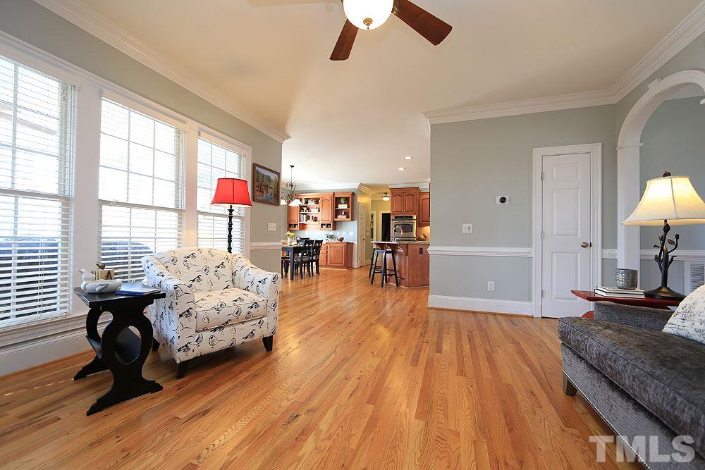 8215 Ortin Lane Raleigh, NC 27612 - Photo 9 of 29 Large eating area with built-in desk and custom shelves!
