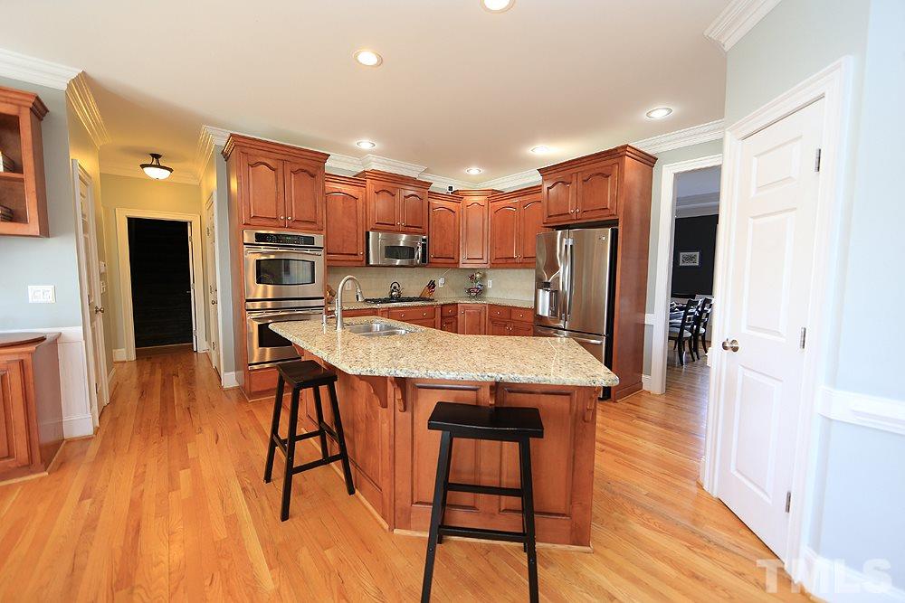 8215 Ortin Lane Raleigh, NC 27612 - Photo 10 of 29 Beautiful granite counter tops with huge island!