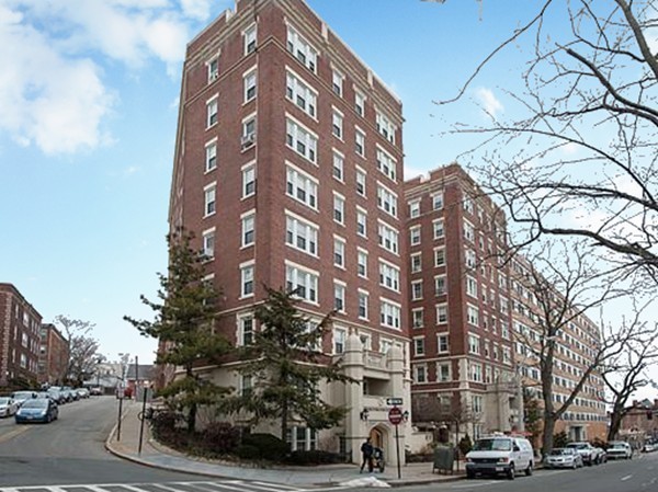 1450 Beacon Street, Unit 504 Brookline, MA 02446 - Photo 12 of 21 a city street lined with buildings and cars