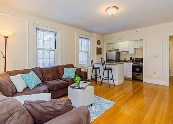 1450 Beacon Street, Unit 504 Brookline, MA 02446 - Photo 3 of 21 a living room with furniture and kitchen view