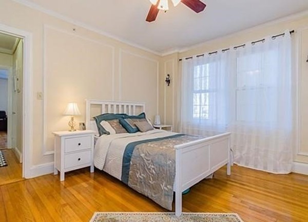 1450 Beacon Street, Unit 504 Brookline, MA 02446 - Photo 4 of 21 a bedroom with a bed and a window