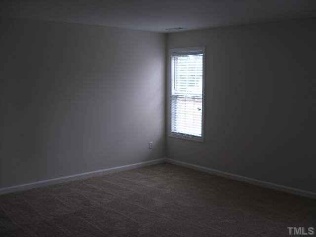 3633 Rendition Street Raleigh, NC 27610 - Photo 7 of 17 an empty room with a window