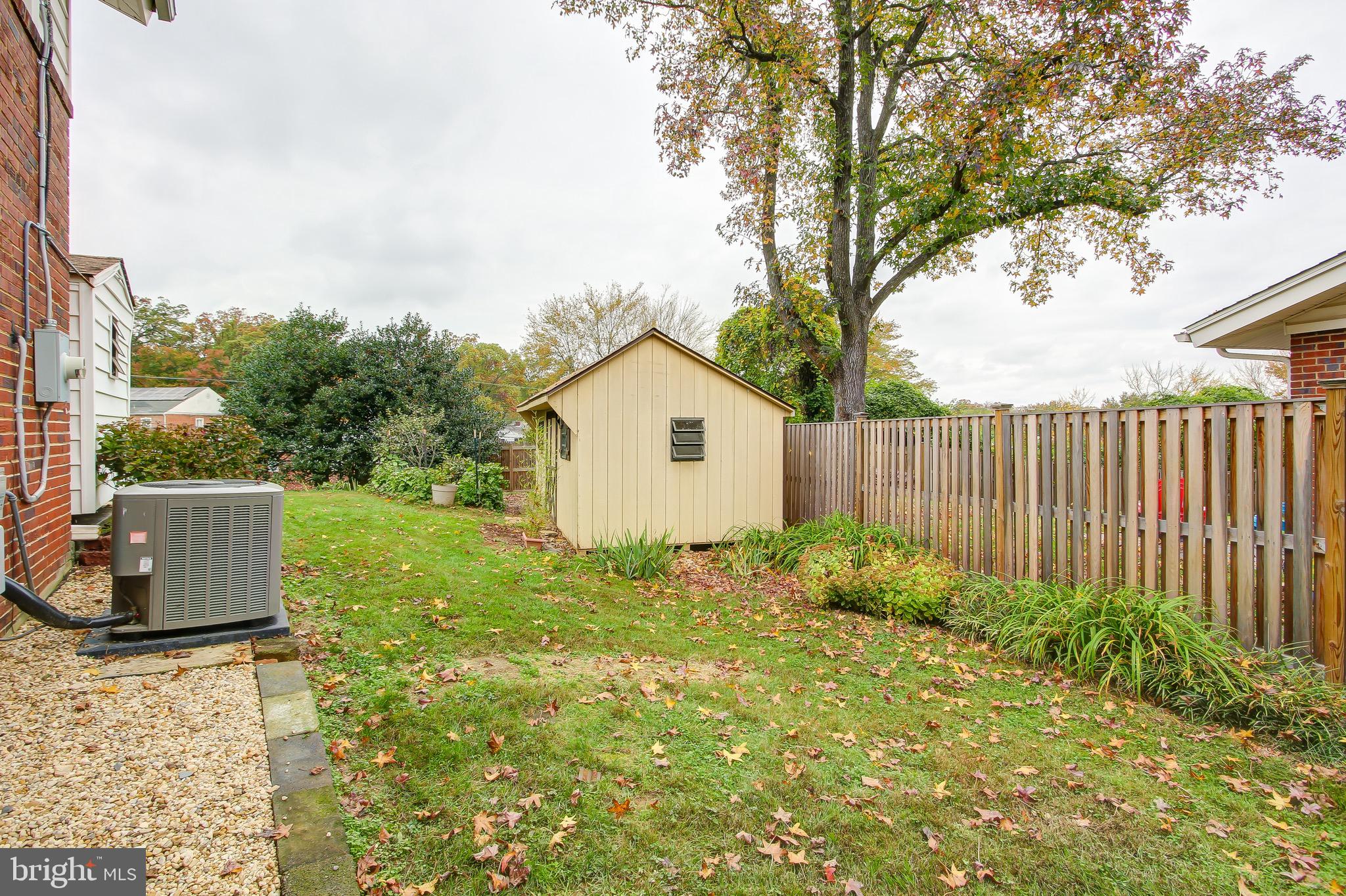 2425 Lillian Drive Silver Spring, MD 20902 - Photo 22 of 27 Fenced Backyard with Storage Sheds