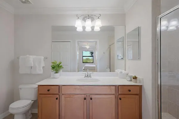 a living room with fireplace furniture and a chandelier