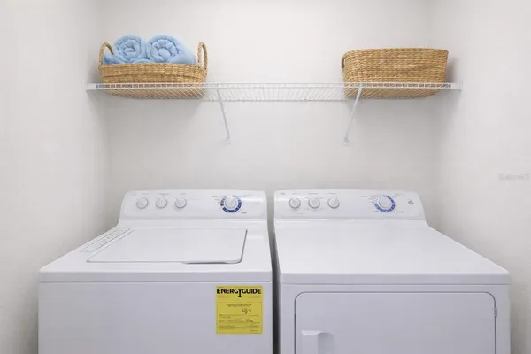 a room with pool table and windows