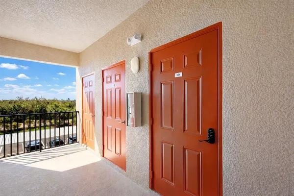 a view of a house with pool and sitting area
