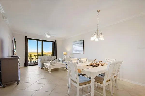 a kitchen with stainless steel appliances granite countertop a stove top oven a sink dishwasher and a refrigerator