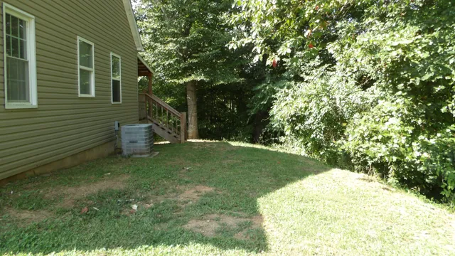 a view of a yard with a trees