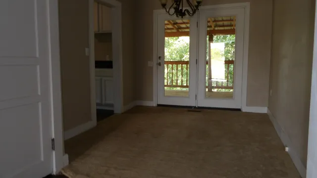 a view of an empty room and window