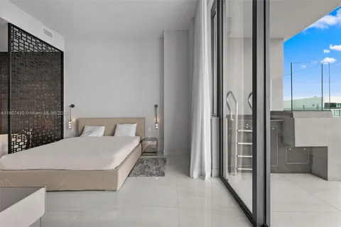 a bathroom with a bathtub and shower