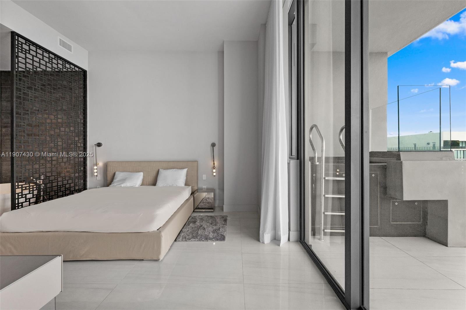 480 Northeast 31st Street, Unit PH5002 Miami, FL 33137 - Photo 7 of 15 a bathroom with a bathtub and shower