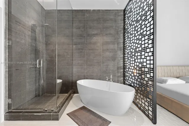 a bathroom with a white toilet and a shower