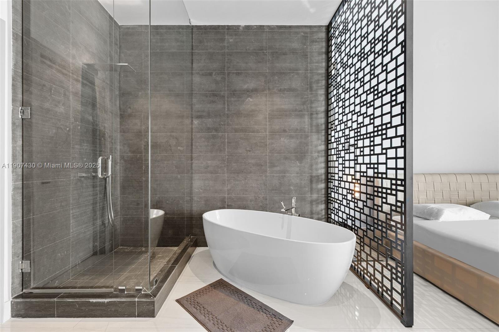 480 Northeast 31st Street, Unit PH5002 Miami, FL 33137 - Photo 9 of 15 a bathroom with a white toilet and a shower