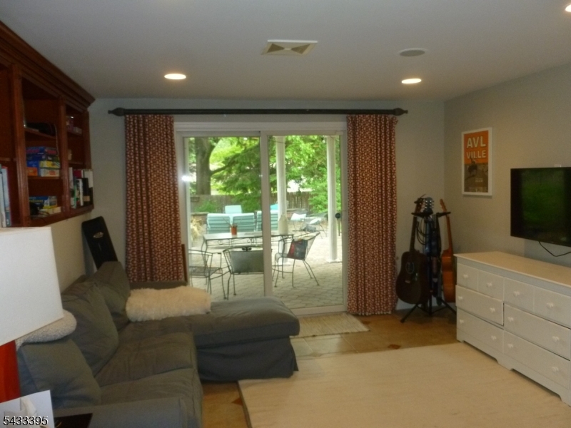 48 Woodmont Road Montclair, NJ 07043 - Photo 16 of 20 a living room with furniture and a flat screen tv