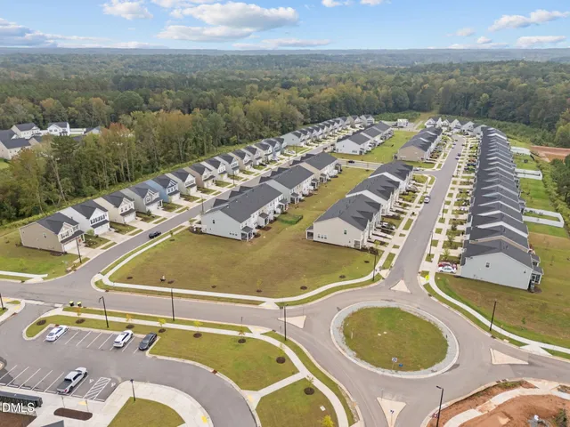 an aerial view of a swimming pool and mountain view