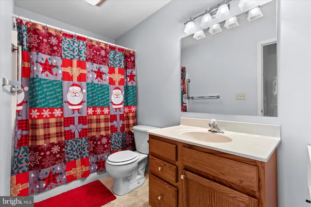 a bathroom with a sink mirror and vanity