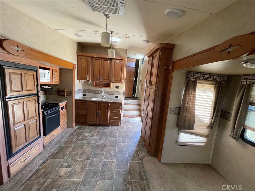 0 Shannon Valley Road Acton, CA 93510 - Photo 5 of 14 a kitchen with stainless steel appliances granite countertop a refrigerator a sink a stove and oven