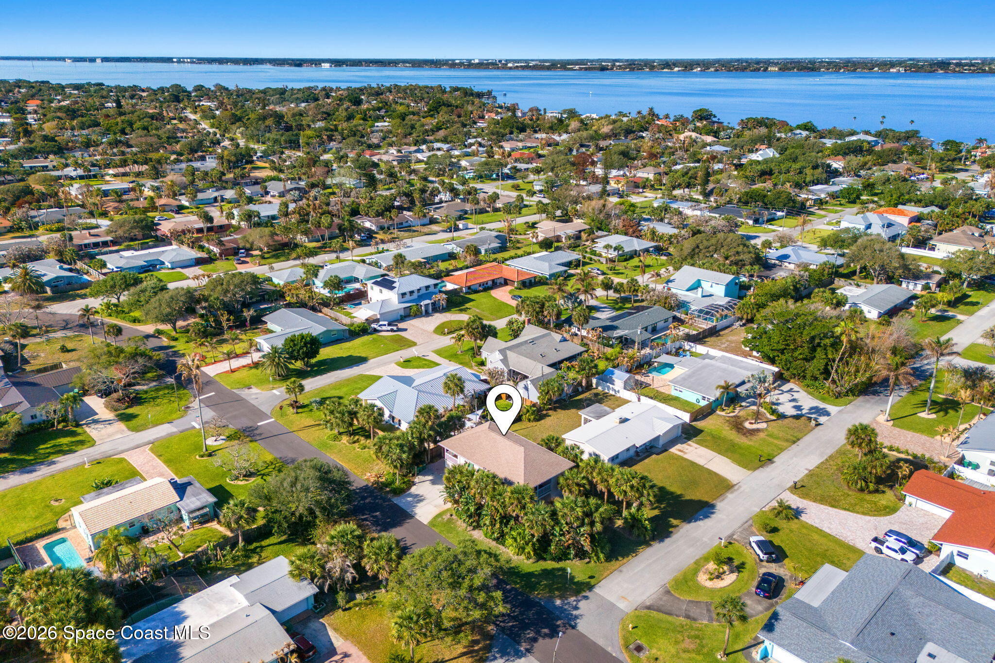 301 7th Avenue Indialantic, FL 32903 - Photo 41 of 58 an aerial view of a city with lots of residential buildings and ocean view in back