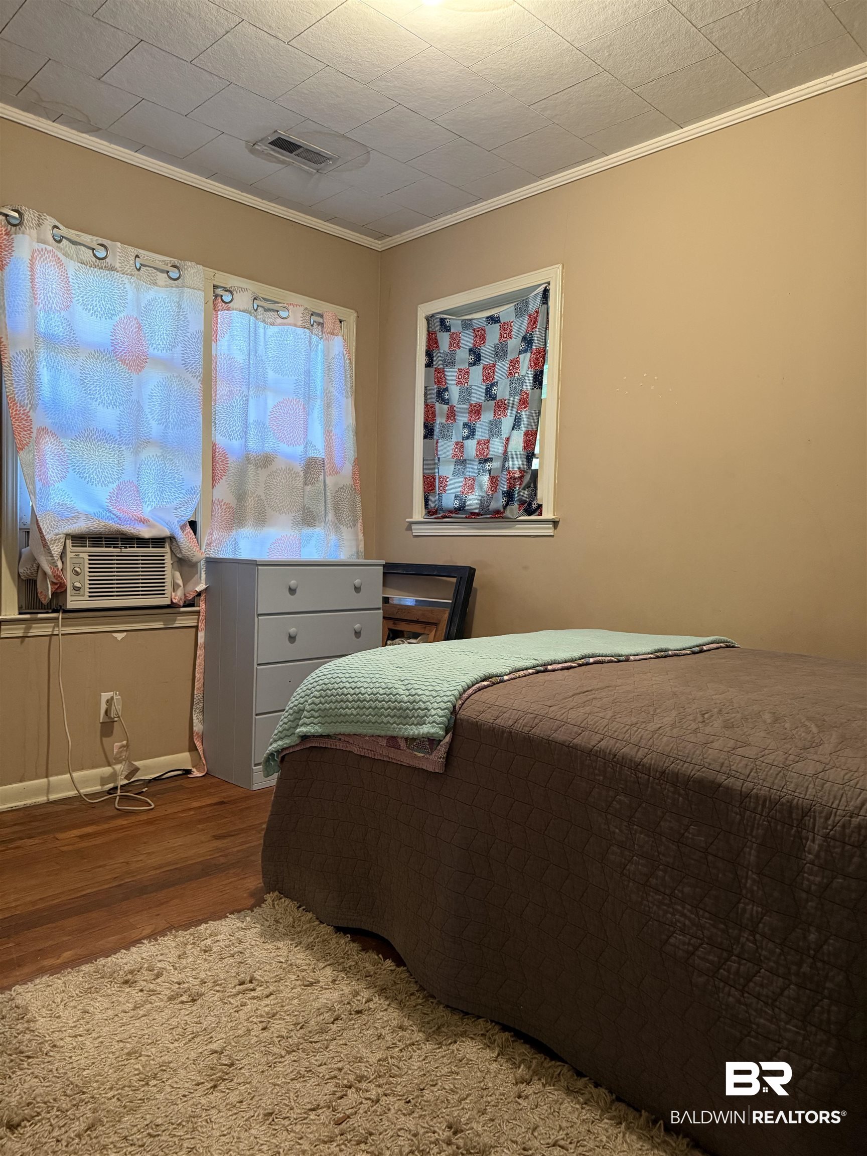 22173 1st Street Silverhill, AL 36576 - Photo 11 of 16 Bedroom with crown molding, wood finished floors, and cooling unit