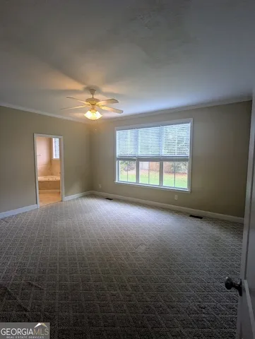 an empty room with a empty space and windows