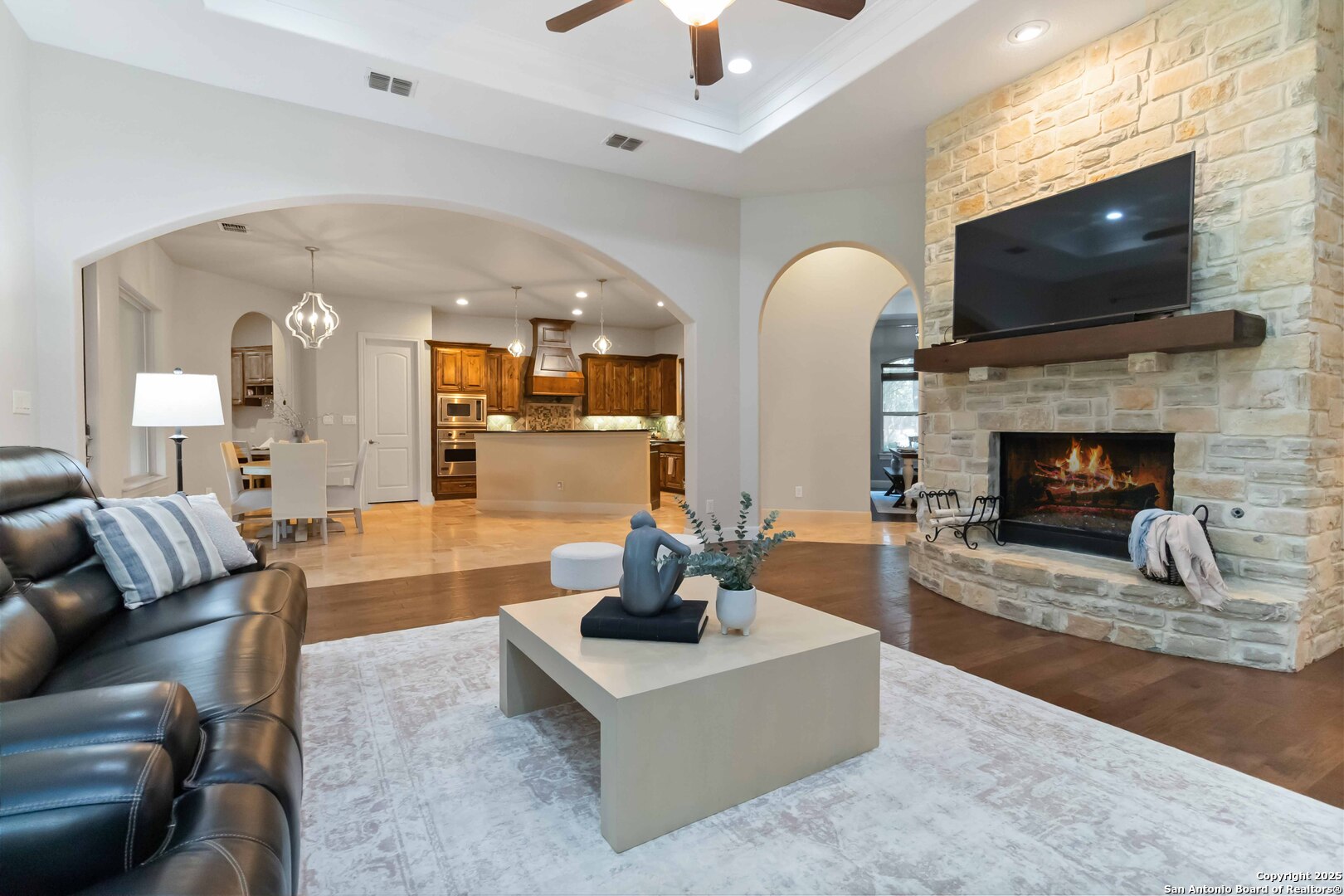 a living room with furniture and a fireplace