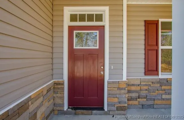 a view of front door of house and window