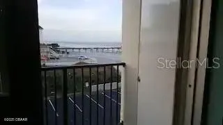 a balcony with table and chairs