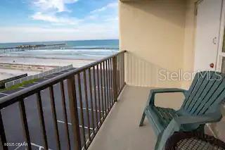 3727 South Atlantic Avenue, Unit 3150 Daytona Beach, FL 32118 - Photo 13 of 39 a balcony with table and chairs