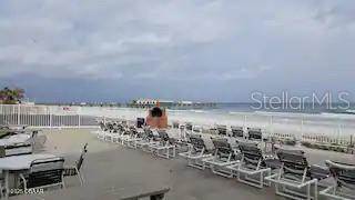 3727 South Atlantic Avenue, Unit 3150 Daytona Beach, FL 32118 - Photo 21 of 39 a view of a terrace with lawn chairs