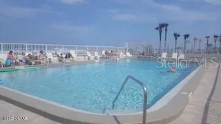 3727 South Atlantic Avenue, Unit 3150 Daytona Beach, FL 32118 - Photo 24 of 39 a view of swimming pool from a balcony