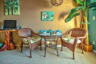 3727 South Atlantic Avenue, Unit 3150 Daytona Beach, FL 32118 - Photo 3 of 39 a view of a workspace with furniture