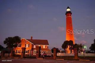 3727 South Atlantic Avenue, Unit 3150 Daytona Beach, FL 32118 - Photo 34 of 39 a street sign on a wall next to a building