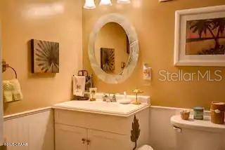 3727 South Atlantic Avenue, Unit 3150 Daytona Beach, FL 32118 - Photo 8 of 39 a bathroom with a sink and a mirror