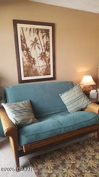 3727 South Atlantic Avenue, Unit 3150 Daytona Beach, FL 32118 - Photo 10 of 39 a bed sitting in a bedroom next to a window