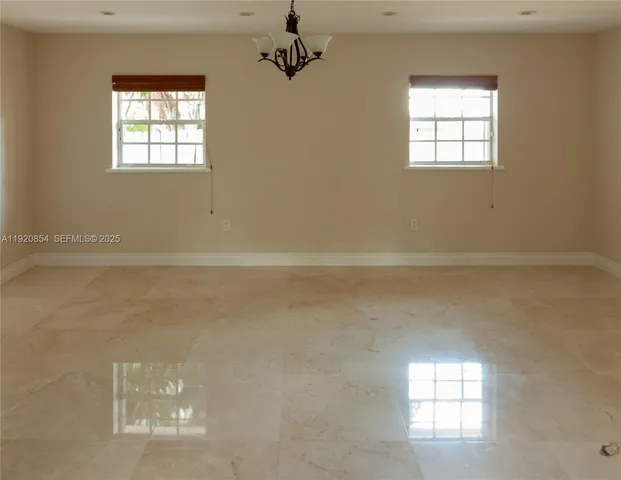 en empty room with windows