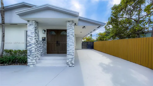 an entrance to house with yard