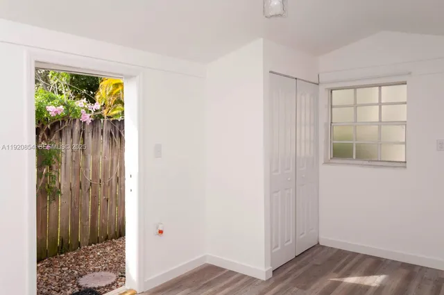 a view of entryway with wooden floor