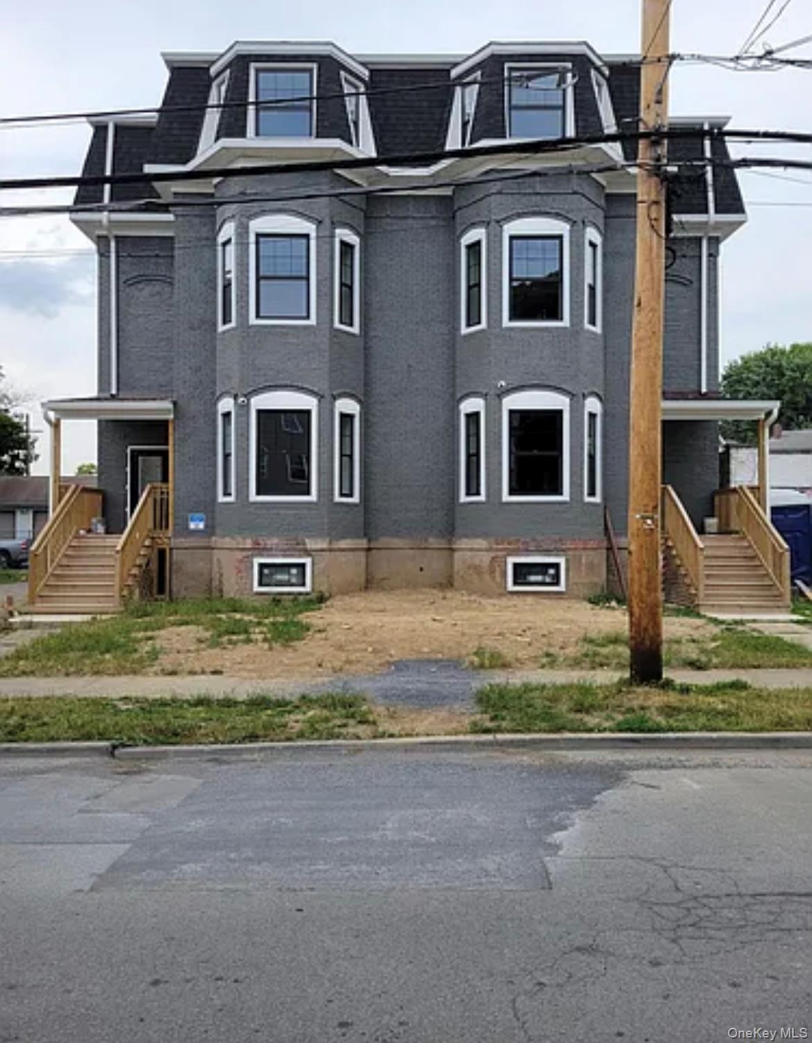 58 Smith Street, Unit 3A Poughkeepsie, NY 12601 - Photo 16 of 16 a front view of a house with a yard