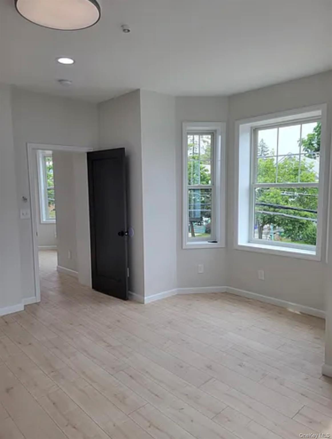 58 Smith Street, Unit 3A Poughkeepsie, NY 12601 - Photo 7 of 16 a view of an empty room with a window