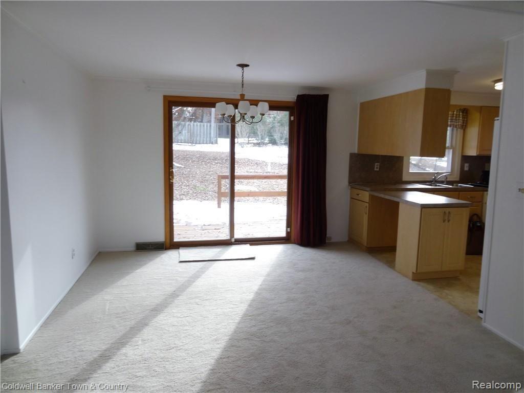 From front door looking to dining room and out to the back deck.  Great light! 