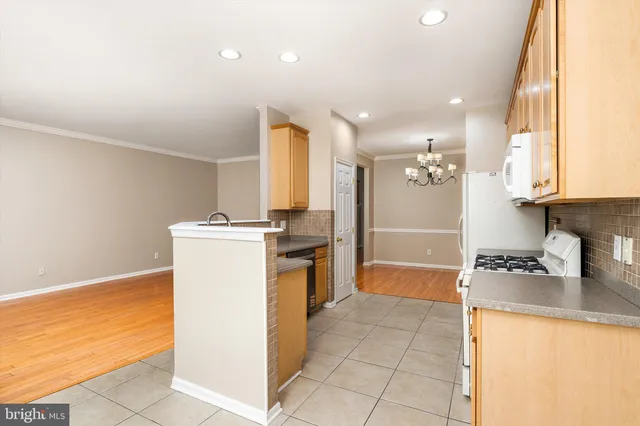 a kitchen with a sink and a stove top oven