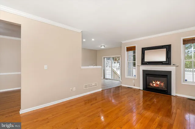 a view of empty room with a fireplace